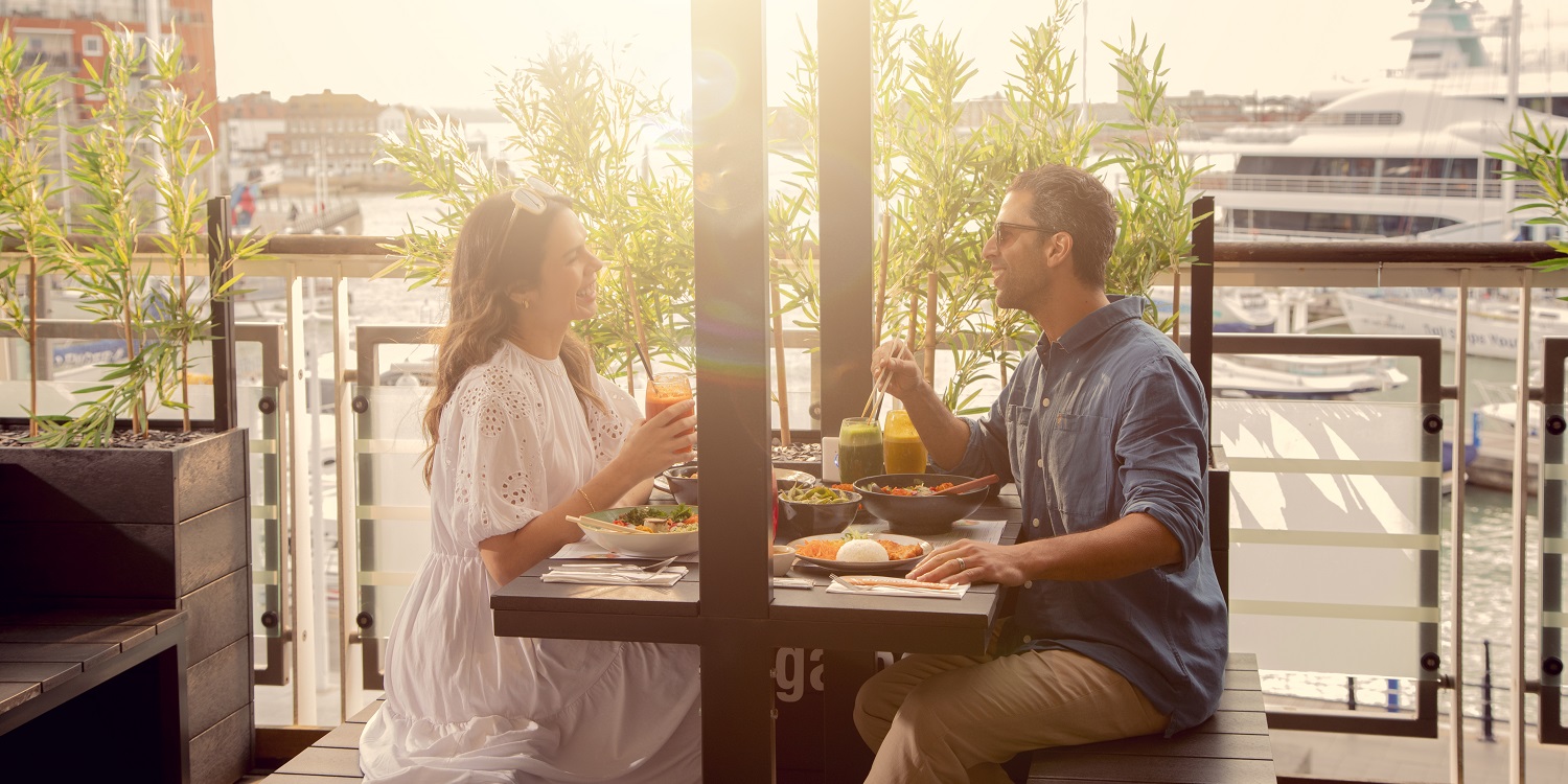 Couple eating at Gunwharf Quays