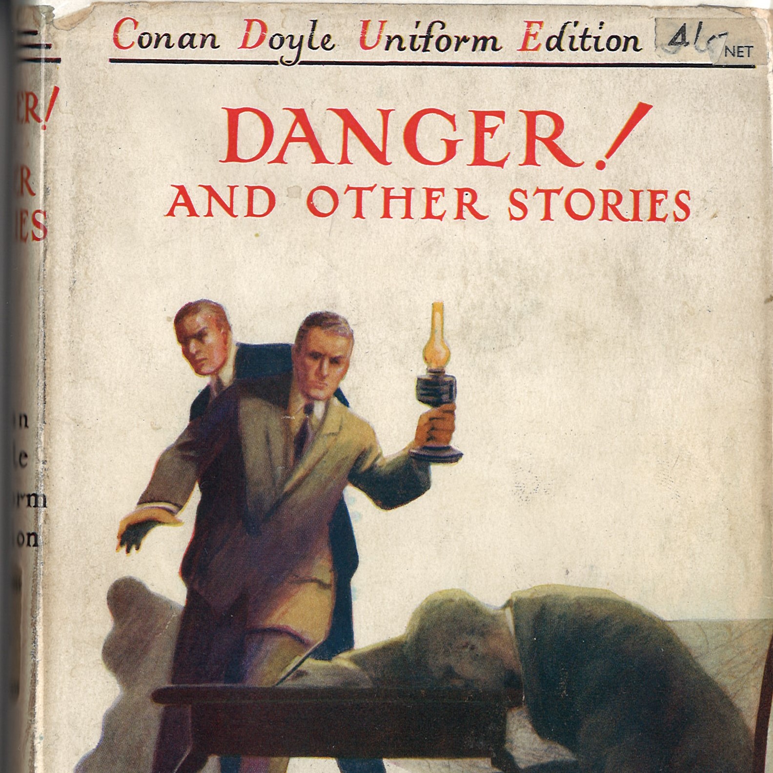 the cover of the book danger and other stories by Conan Doyle observing a man dead at a table mid writing a message